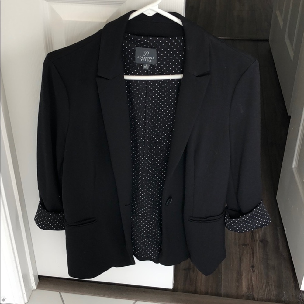 Black blazer with white polka dot liner